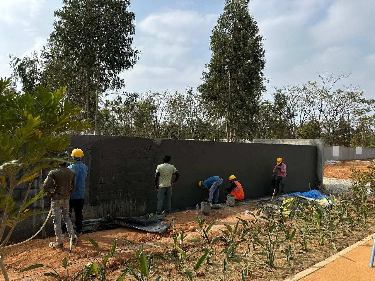 Compound wall plastering work in progress