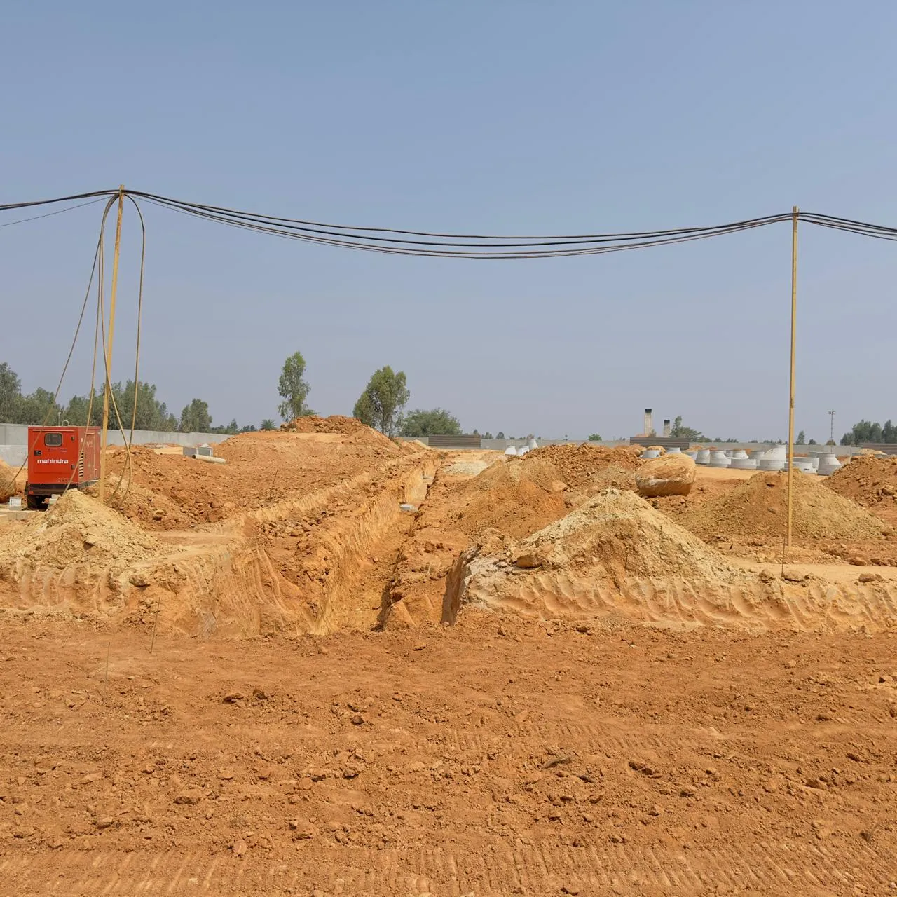 Excavation for sewage line works in progress.