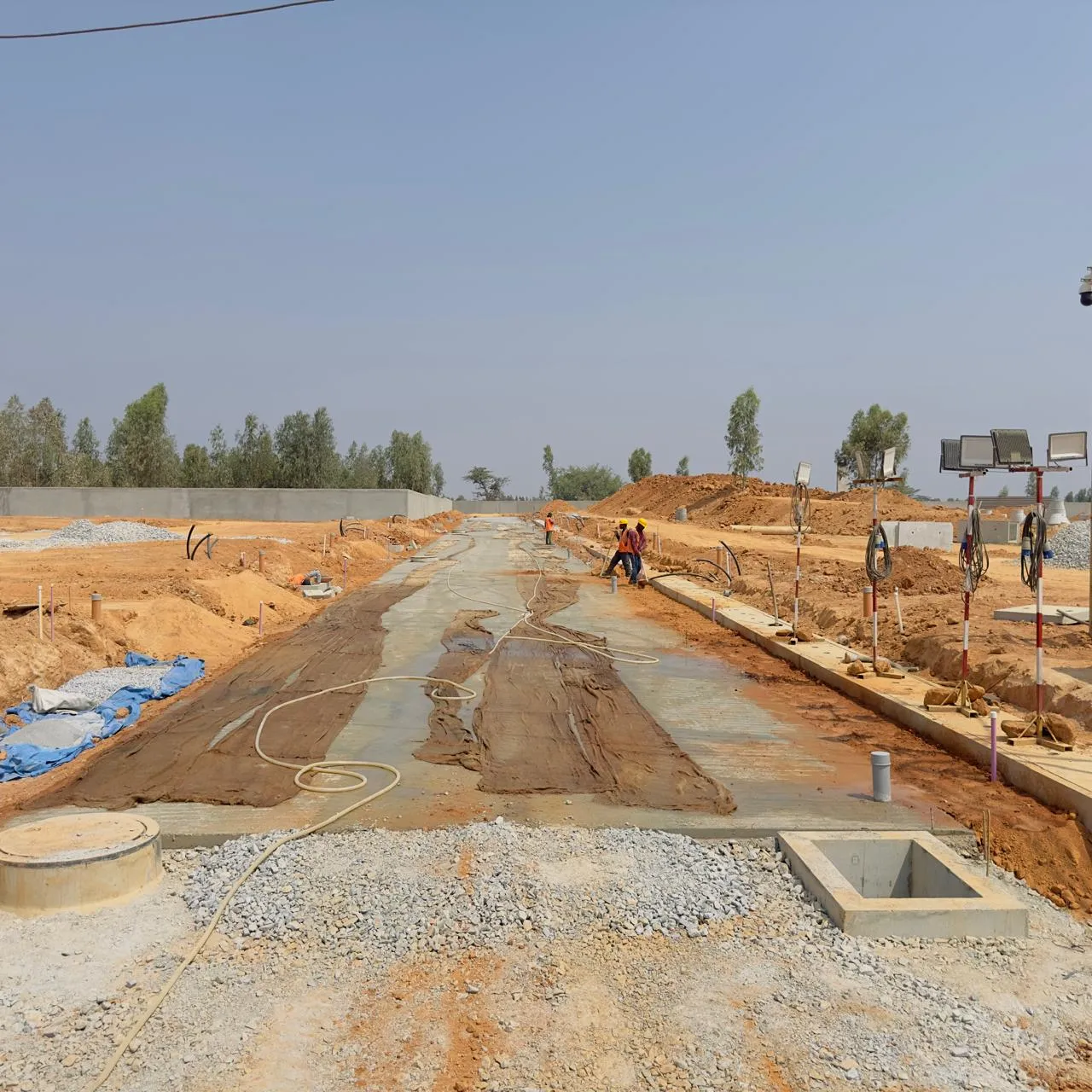 PCC work completed and curing works in progress.