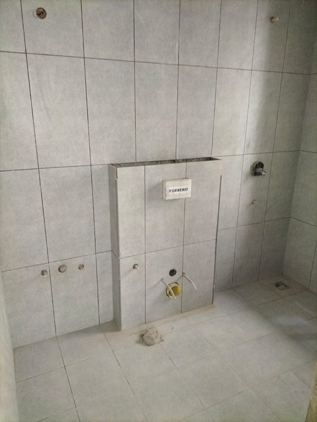Tiling works are in progress.