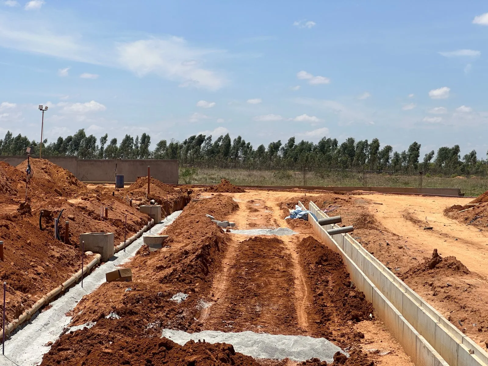 All services works are completed, and road compaction works in progress.