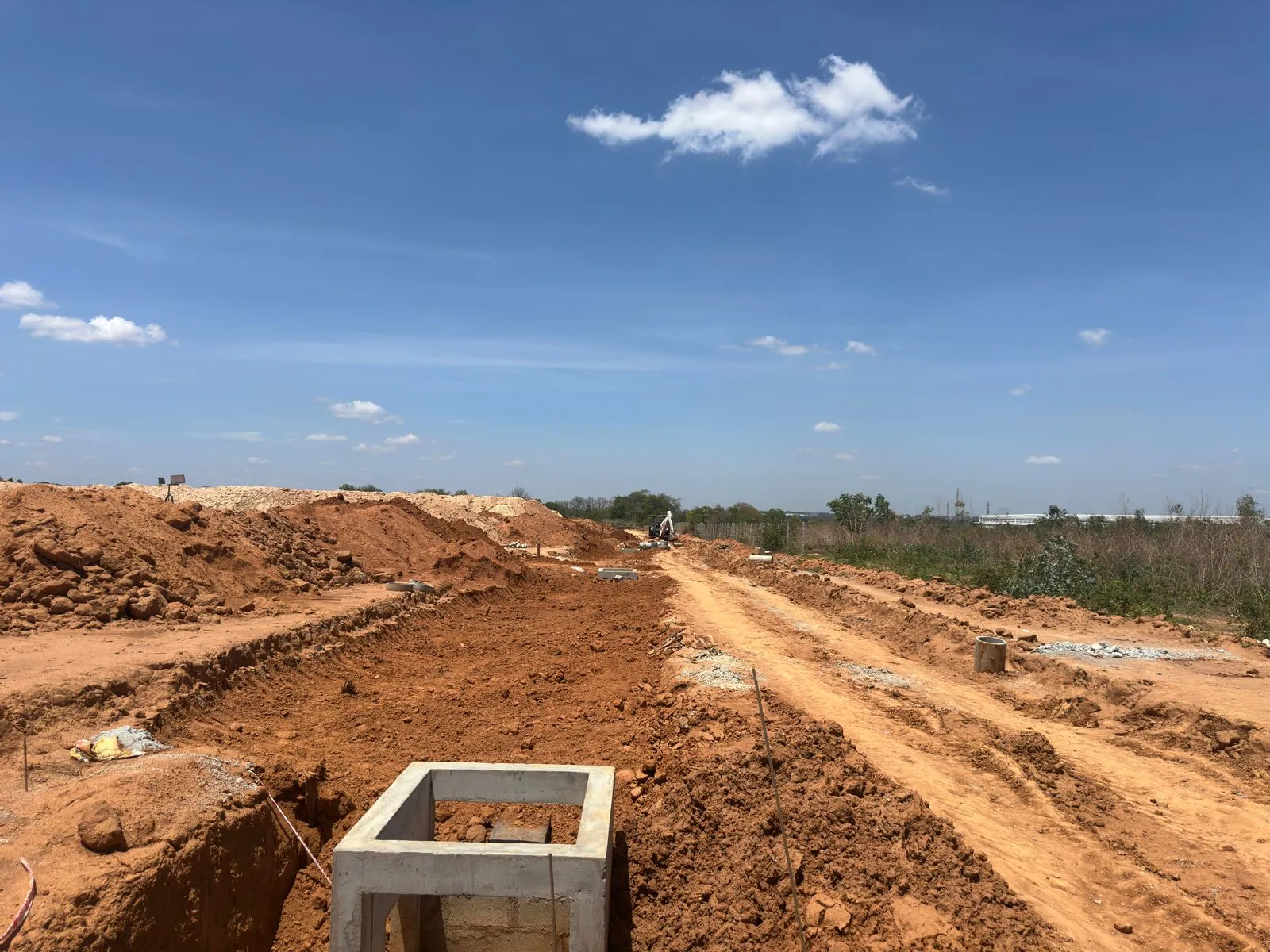 Electrical chambers and hume pipes laying works completed and soil backfilling works in progress.