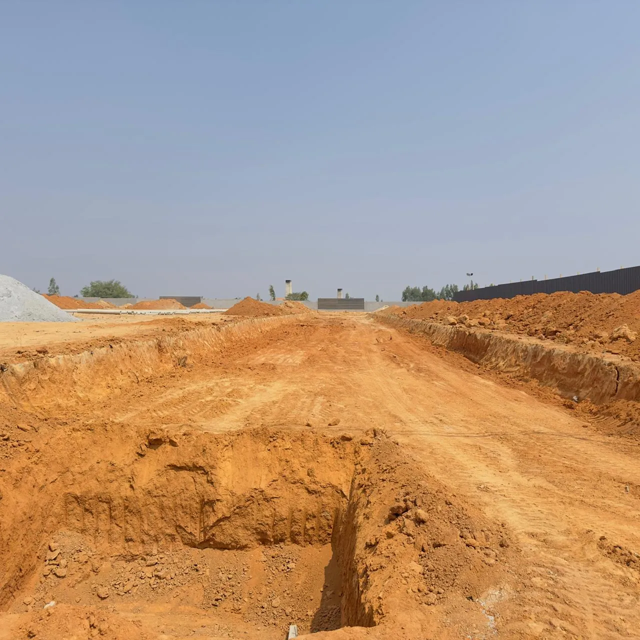 Road formation and excavation for sewage works in progress.