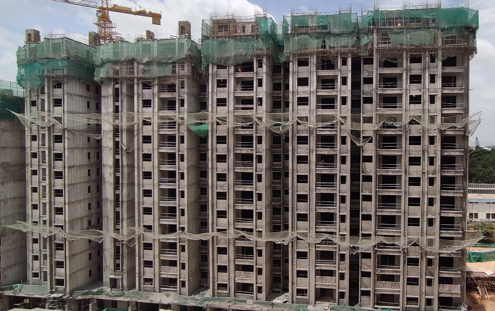 Tower C 14th Floor - slab completed. Reinforcement & shuttering work in progress for few sections of the slab on the 15th floor