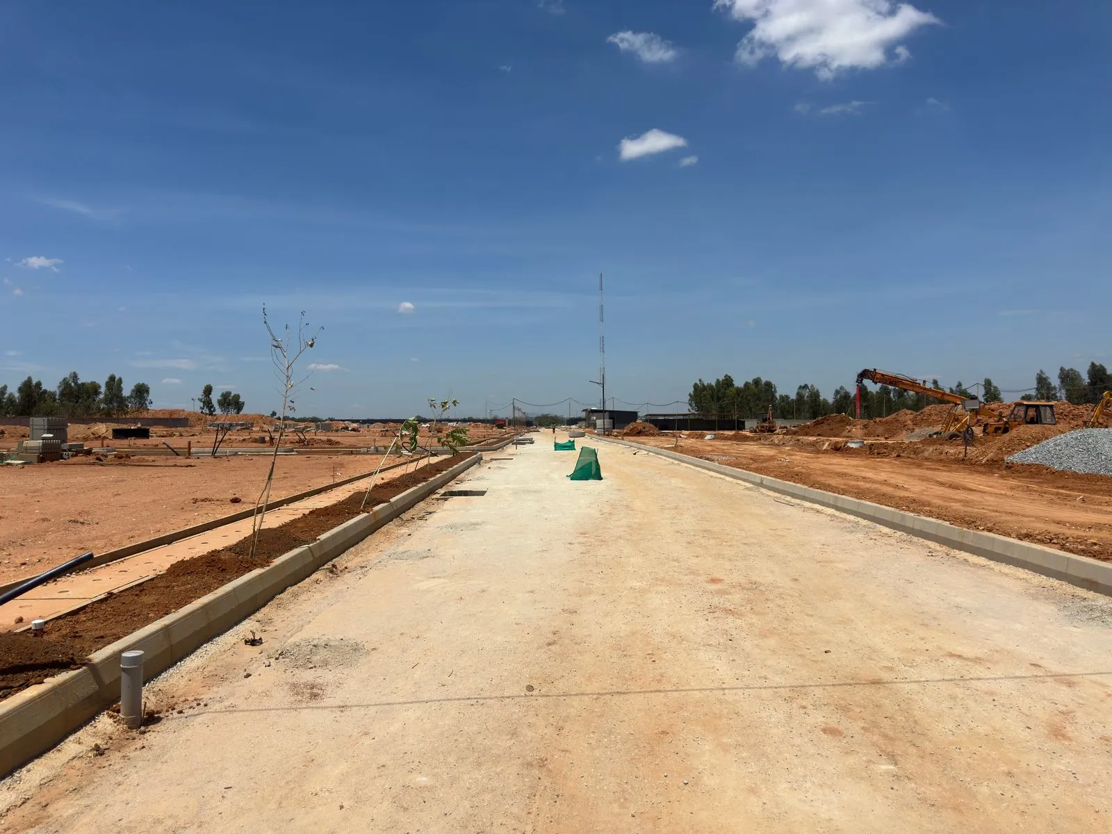 Main road | all services works, PCC works, kerb installation works completed.