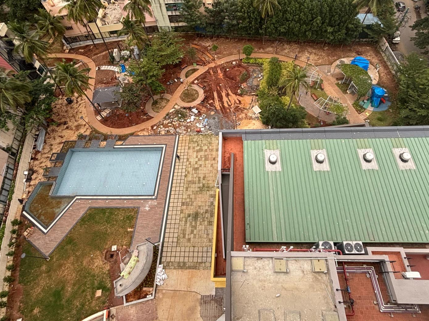 Swimming pool surrounding area hardscape works completed. Softscape works are in progress