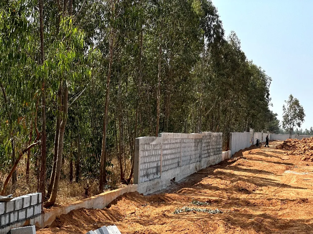 Compound wall block work in progress on south side.