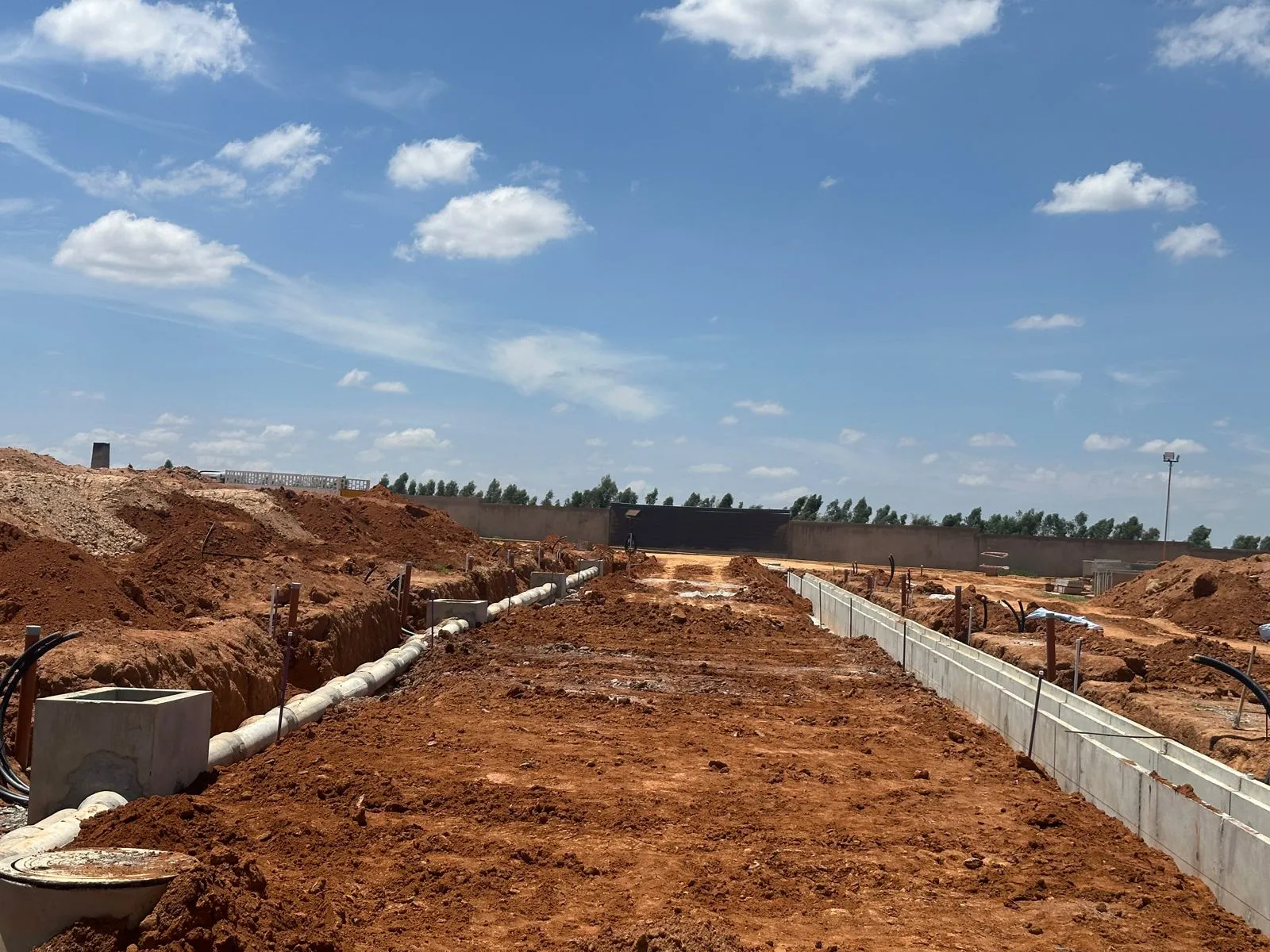 All services works are completed, and road compaction works in progress.