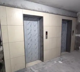 Floor tiling work in progress Plastering work in progress Fixing of Doors and windows is underway Lift installation work in progress