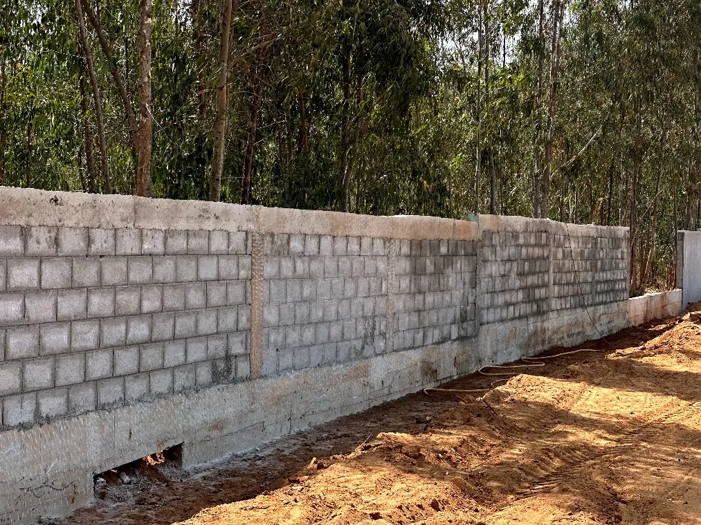 Compound wall block work in progress on south side.